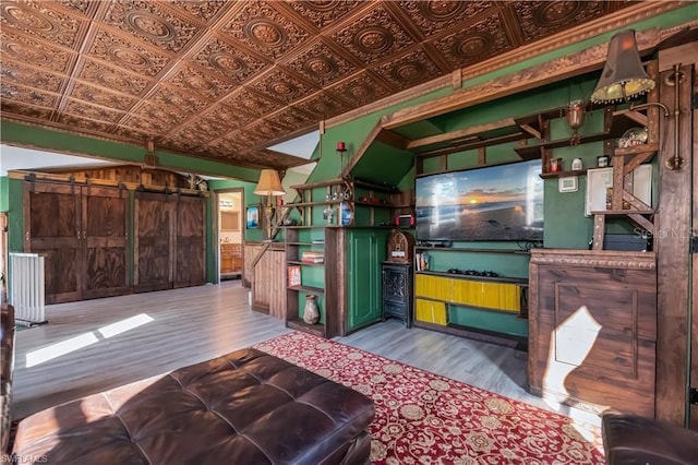 interior space featuring a barn door and light hardwood / wood-style flooring