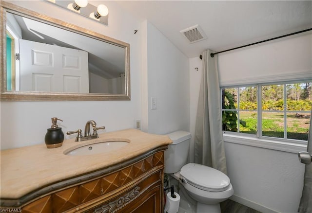 bathroom with vanity and toilet