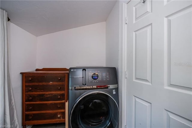 clothes washing area featuring washer / clothes dryer