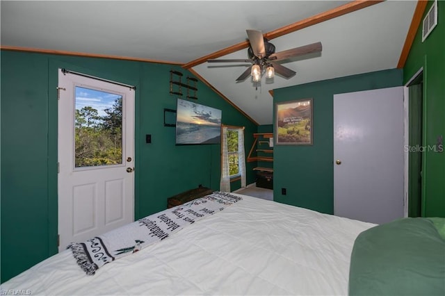 bedroom featuring multiple windows, vaulted ceiling, and ceiling fan