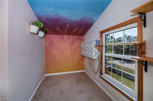 additional living space with lofted ceiling and carpet flooring