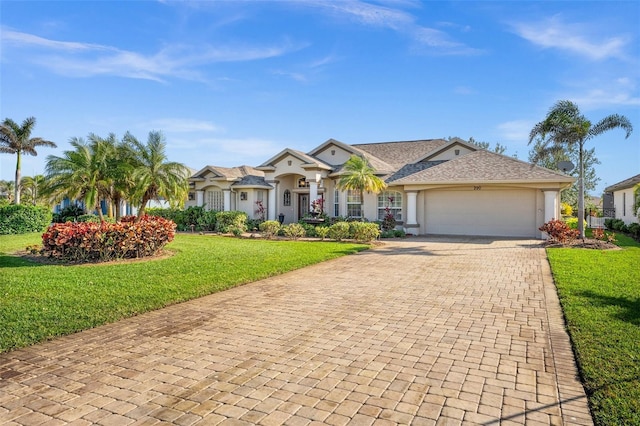 single story home with a garage and a front yard