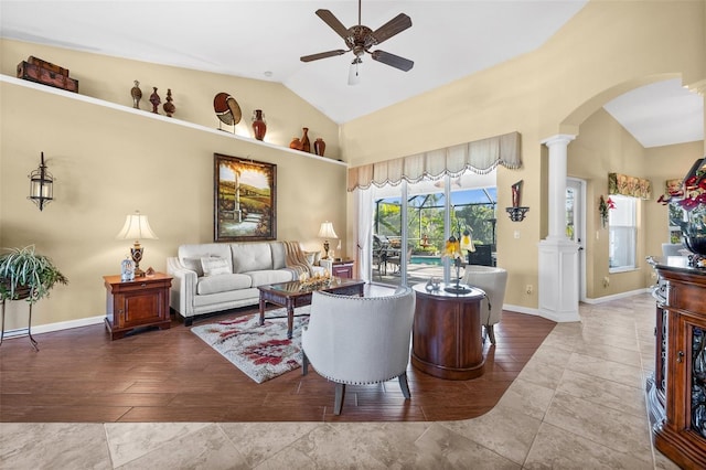 living room with lofted ceiling, tile patterned flooring, decorative columns, and ceiling fan