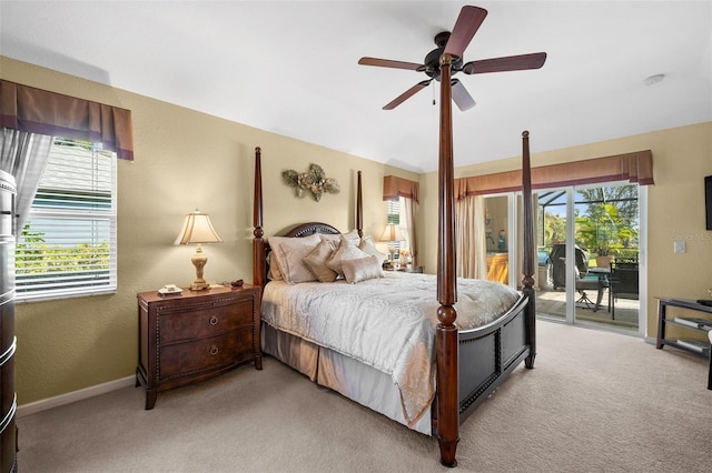 bedroom featuring light carpet, access to exterior, and ceiling fan