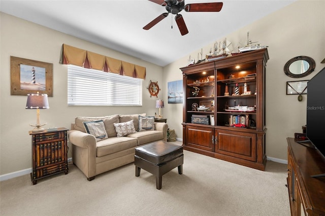 carpeted living room with lofted ceiling and ceiling fan