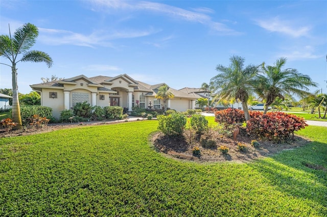 ranch-style home with a garage and a front yard