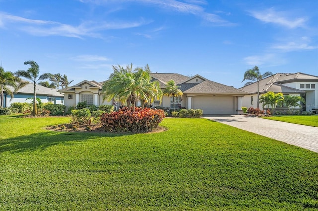 ranch-style home with a garage and a front yard