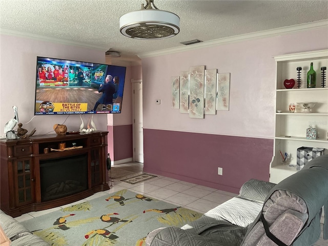 tiled living room featuring ornamental molding and a textured ceiling