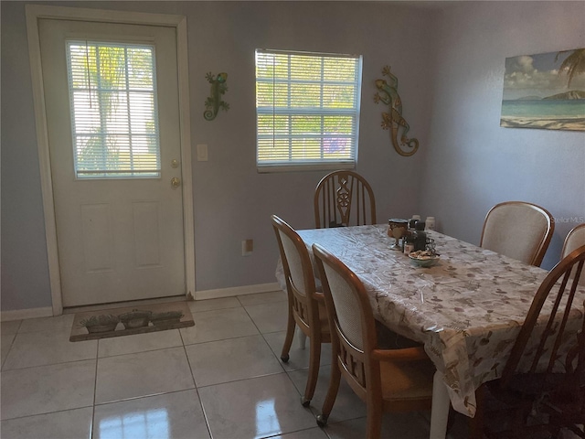 12077 Maryland Ave, Punta Gorda, FL 33955 - dining area featuring light tile patterned floors and a healthy amount of sunlight