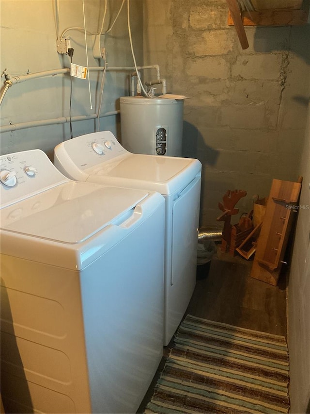12077 Maryland Ave, Punta Gorda, FL 33955 - laundry room featuring dark hardwood / wood-style floors, washing machine and dryer, and electric water heater