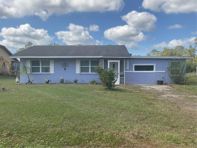 12077 Maryland Ave, Punta Gorda, FL 33955 - ranch-style house with a front lawn