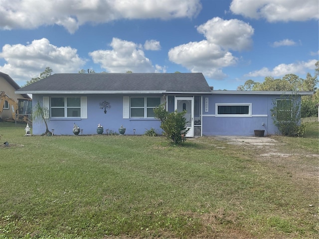 ranch-style house with a front lawn