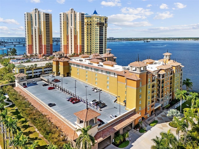 birds eye view of property with a water view