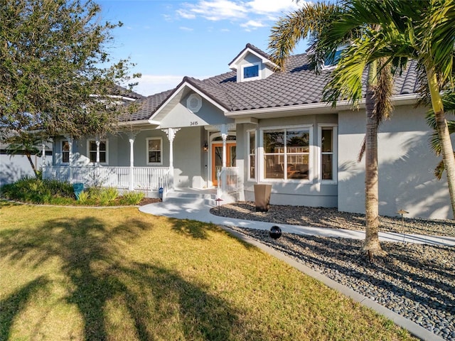 3415 Tripoli Blvd, Punta Gorda, FL 33950 - view of front facade with a front lawn and a porch