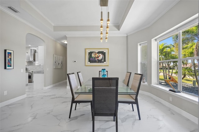 3415 Tripoli Blvd, Punta Gorda, FL 33950 - dining area featuring crown molding, a notable chandelier, and a raised ceiling