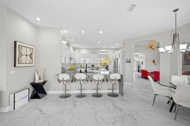 3415 Tripoli Blvd, Punta Gorda, FL 33950 - dining space featuring sink and a notable chandelier