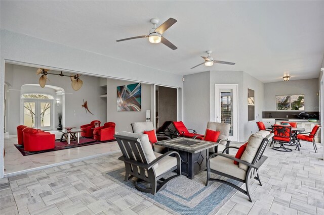 3415 Tripoli Blvd, Punta Gorda, FL 33950 - view of patio / terrace featuring ceiling fan, an outdoor fire pit, and french doors
