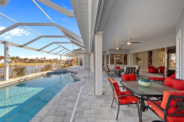 3415 Tripoli Blvd, Punta Gorda, FL 33950 - view of swimming pool with ceiling fan, a water view, glass enclosure, and a patio