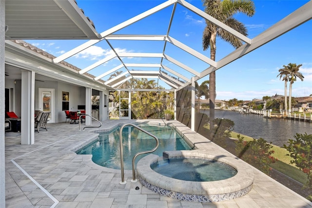 3415 Tripoli Blvd, Punta Gorda, FL 33950 - view of swimming pool featuring a water view, an in ground hot tub, ceiling fan, a patio, and a lanai
