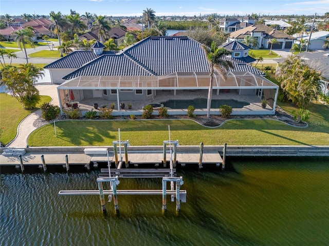 3415 Tripoli Blvd, Punta Gorda, FL 33950 - rear view of property featuring a yard, a lanai, and a water view