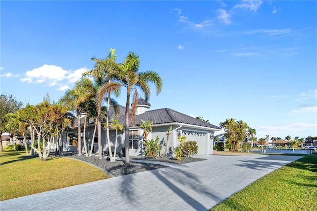 3415 Tripoli Blvd, Punta Gorda, FL 33950 - view of front facade featuring a front lawn and a garage