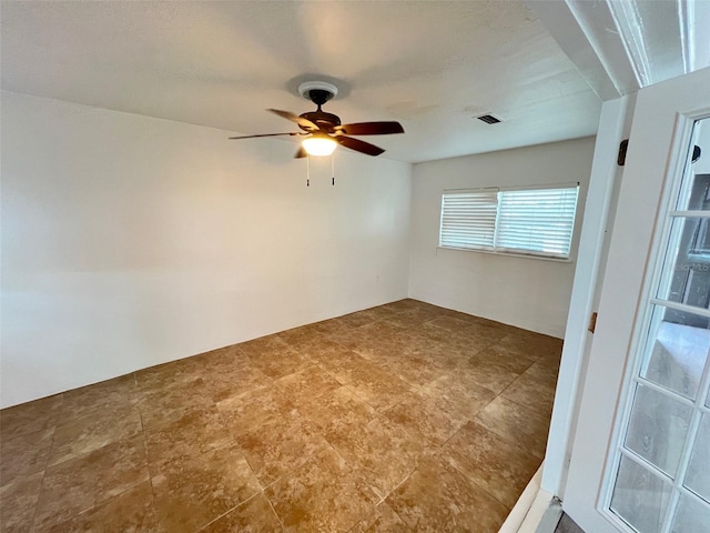 unfurnished room featuring ceiling fan