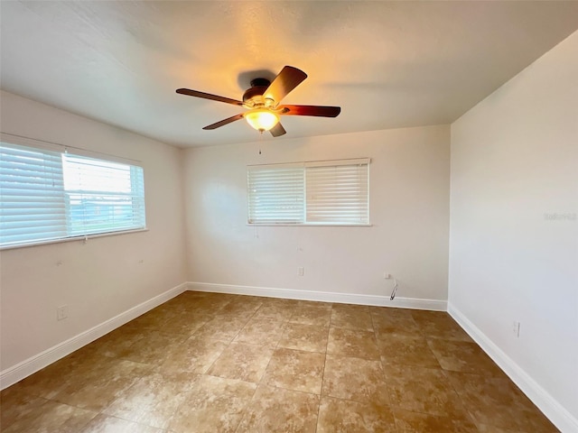 unfurnished room with ceiling fan