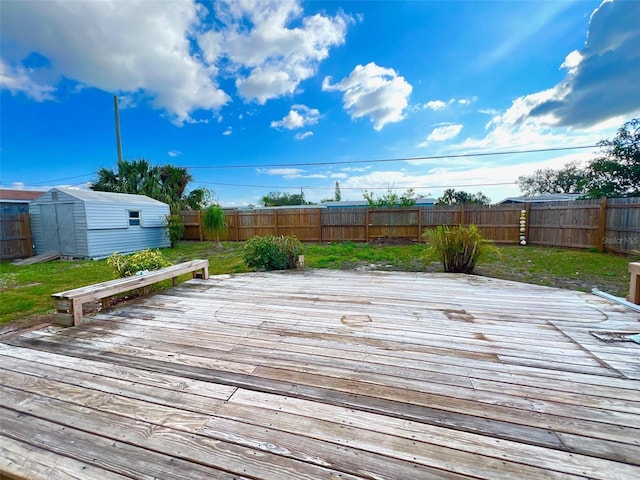 wooden terrace featuring a storage unit