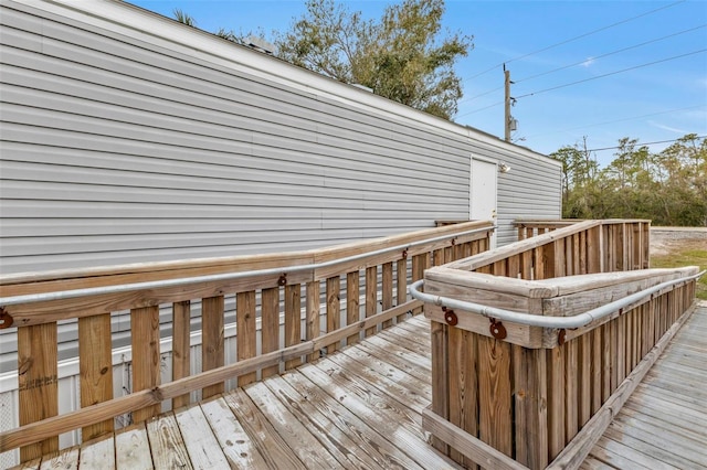 wooden terrace with a hot tub