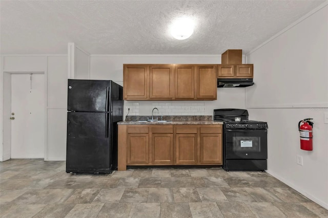 kitchen featuring sink, backsplash, black appliances, and a textured ceiling