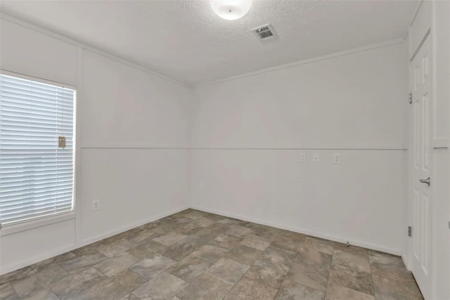 empty room with a textured ceiling