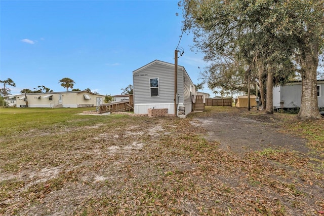 back of house with a wooden deck