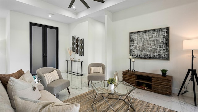 sitting room featuring ceiling fan