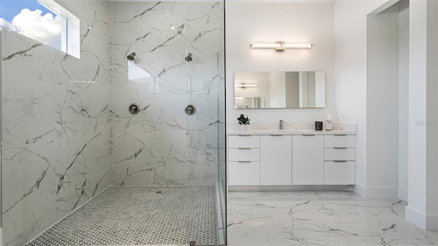 bathroom featuring vanity and tiled shower