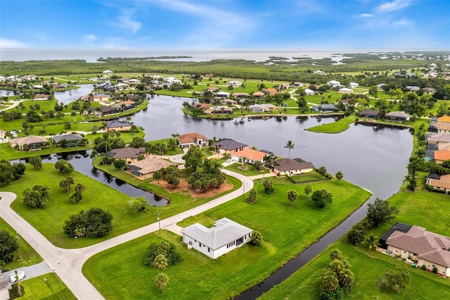 bird's eye view with a water view