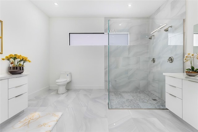 bathroom featuring tiled shower, vanity, and toilet