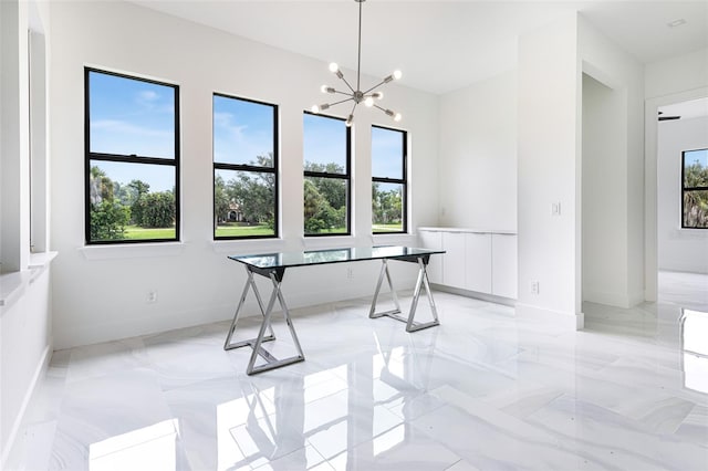 dining space featuring a notable chandelier