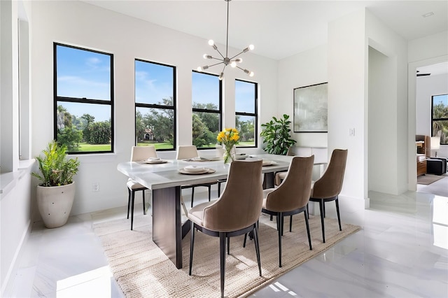 dining room featuring a notable chandelier