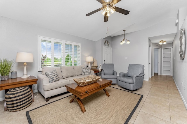 tiled living room featuring ceiling fan and vaulted ceiling