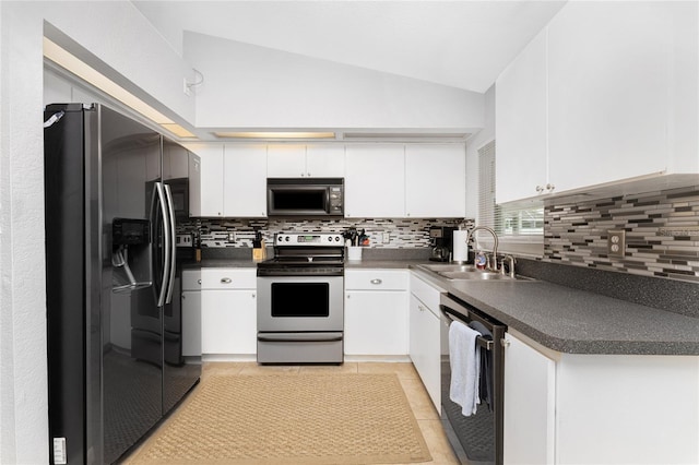 kitchen with appliances with stainless steel finishes, sink, decorative backsplash, and white cabinets