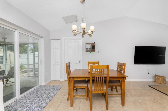 dining space featuring a notable chandelier, vaulted ceiling, and light tile patterned flooring