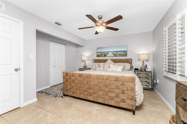 bedroom featuring ceiling fan and tile patterned floors