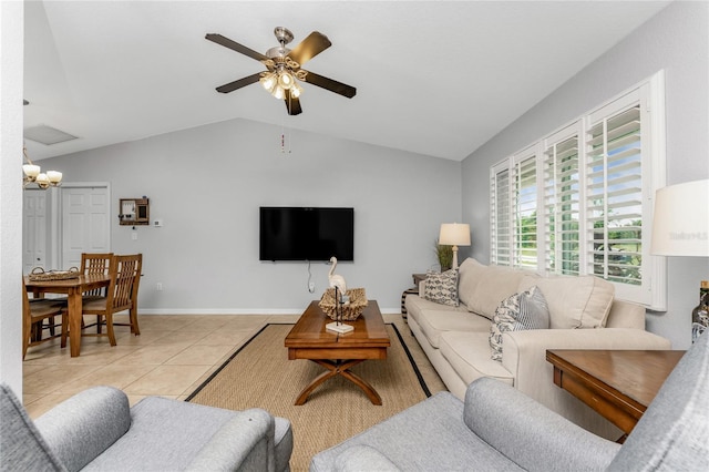 tiled living room featuring ceiling fan and lofted ceiling