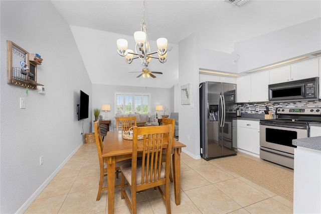 dining room with lofted ceiling, light tile patterned floors, and ceiling fan with notable chandelier