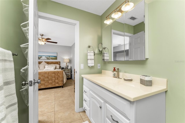 bathroom featuring ceiling fan, tile patterned floors, and vanity