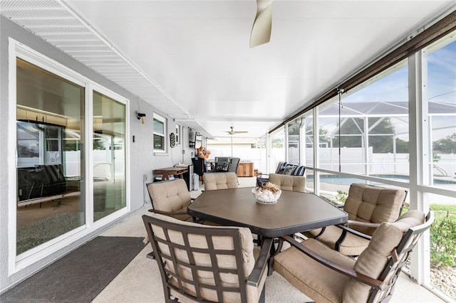 sunroom / solarium with ceiling fan