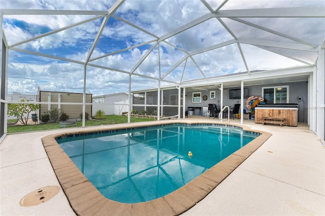 view of swimming pool with a lanai, a jacuzzi, and a patio