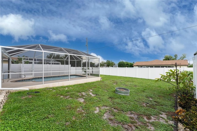 view of yard featuring a fenced in pool and a lanai