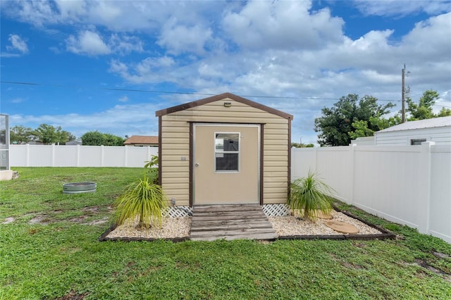 view of outdoor structure with a lawn