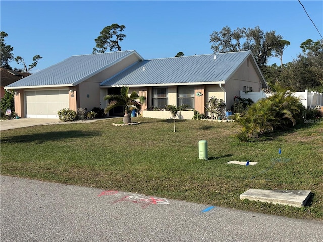 single story home featuring a garage and a front lawn